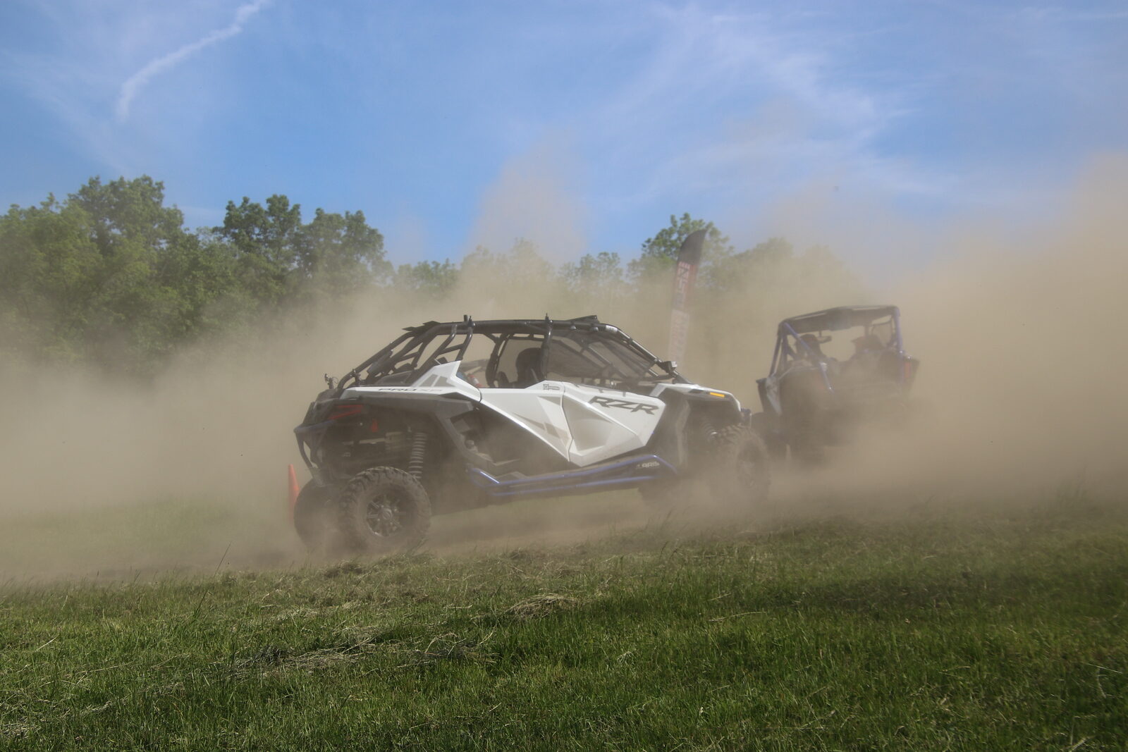 Lou's Pro XP #15 chasing another car through dust