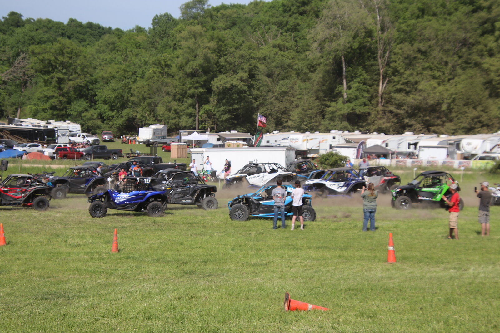 A row of UTVs staged at the starting line